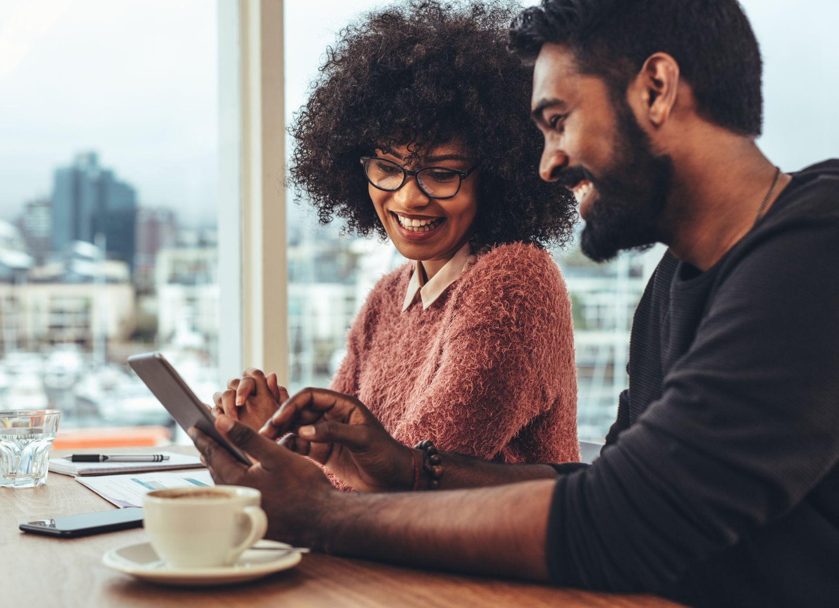 AANWP Mentorship Program - Board Certified Practitioner Training and Development AANWP board certified practitioners in mentorship session with tablet and laptop in bright office overlooking city